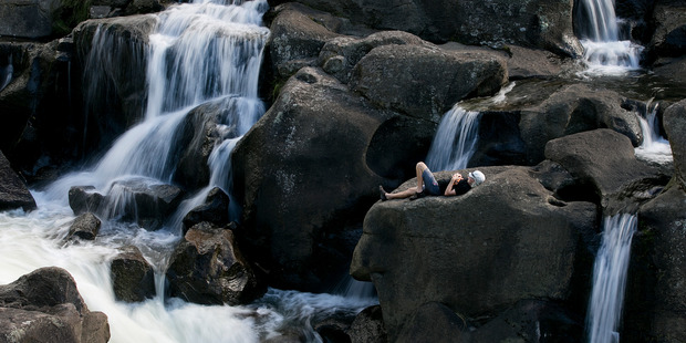 One person took advantage of the North Island's lingering summer heat this weekend to bake on a rock ledge at McLaren Falls in the Kaimai Ranges west of Tauranga. Photo / Alan Gibson