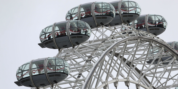 People remain in pods on the London Eye after it was stopped in the aftermath of the attack. Photo / AP