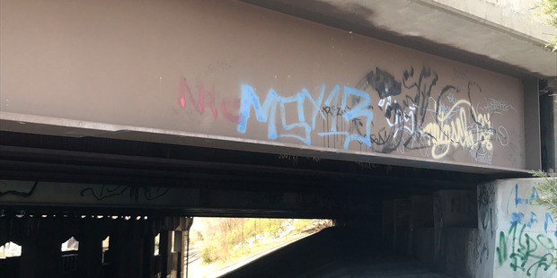 Gang graffiti marks a highway bridge in Springfield, Virginia, where police found Damaris' body. Photo / Michael Miller, Washington Post