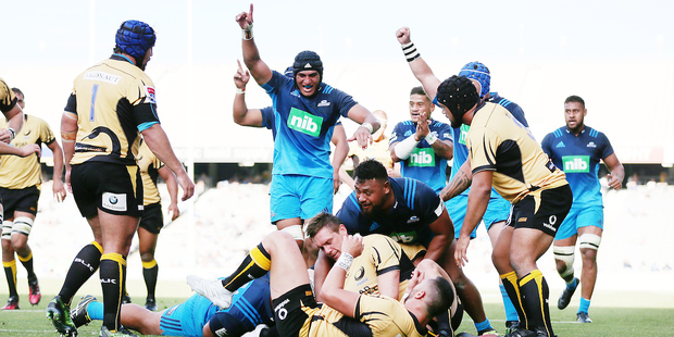 Blues players celebrate Akira Ioane's try. Photo / Photosport