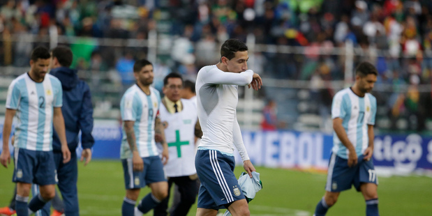Argentina's angel Di Maria and teammates leave the pitch after their 0-2 lost against Bolivia. Photo / AP