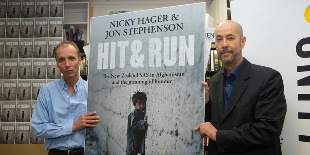 Authors Nicky Hager, left, and Jon Stephenson with their book, Hit & Run. Photo / Mark Mitchell