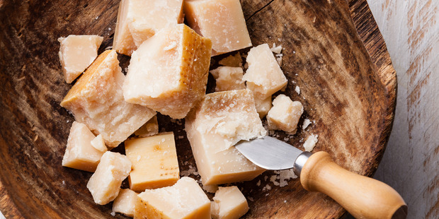 Mould can't penetrate harder cheeses such as parmesan and cheddar. Photo / Getty Images