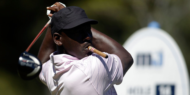 NBA legend Michael Jordan showing off his golf skills. Photo / Getty Images.
