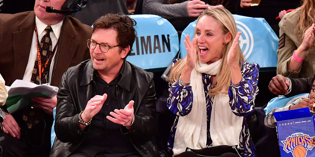 Michael J. Fox and wife Tracy Pollan attend a New York Knicks game. Photo / Getty