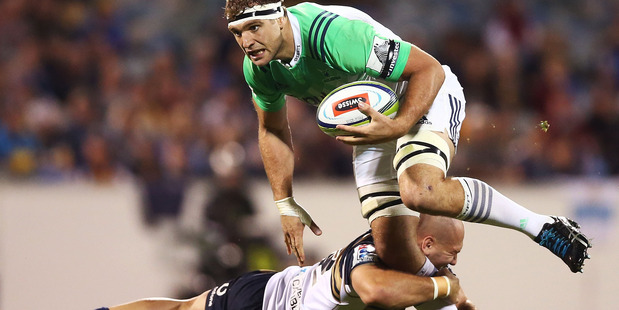 Luke Whitelock of the Highlanders is tackled by Robbie Abel of the Brumbies. Photo / Mark Metcalfe