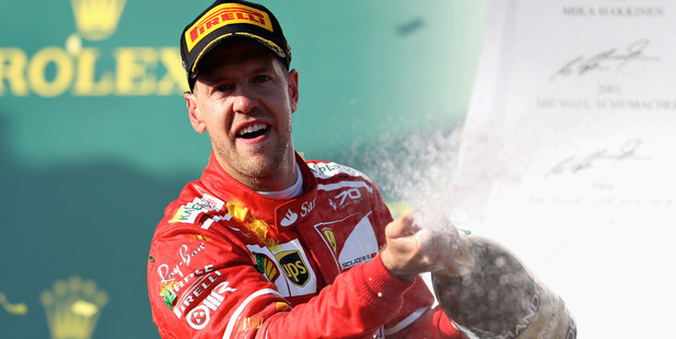 Sebastian Vettel celebrates his win on the podium during the Australian F1 Grand Prix. Photo / Getty Images
