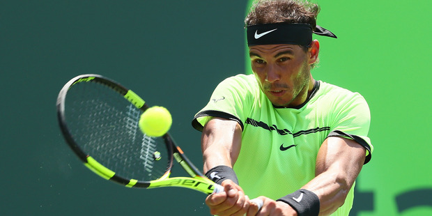 Rafael Nadal of Spain returns a shot against Fabio Fognini of Italy. Photo/Getty Images