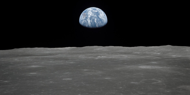 Earth rising over the moon's horizon, taken by the crew of Apollo 11. CREDIT: NASA