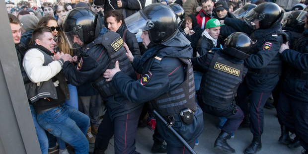 Police detain protesters in Pushkin Square, downtown Moscow, Russia. Photo / AP