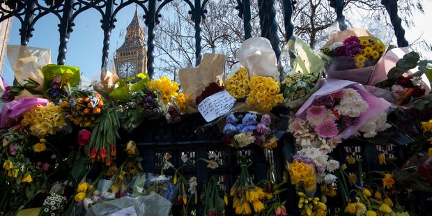 Floral tributes to the victims of the Westminster terrorist attack placed outside the Palace of Westminster. Photo / AP