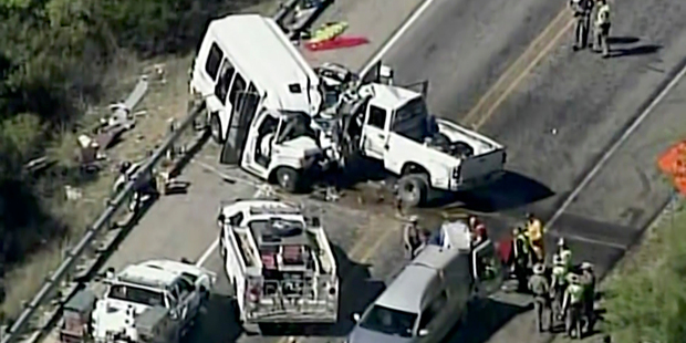 A deadly crash involving a van carrying church members and a pickup truck on U.S. 83 outside Garner State Park. Photo / AP