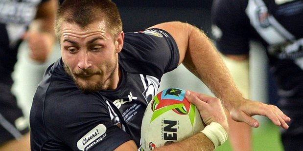 New Zealand's Kieran Foran is held by England's Gareth Widdop during the 2014 Four Nations. Photo/ODT