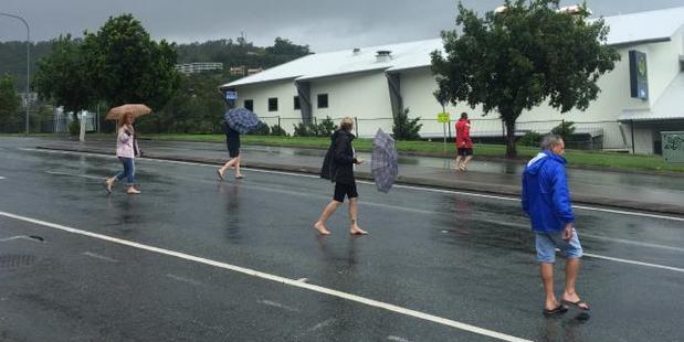 Tourists are among those caught up in Cyclone Debbie. Photo / Emma Reynolds, news.com.au
