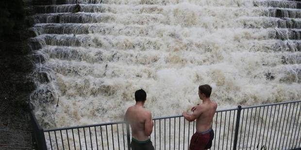 Drains turn into giant Waterfalls on the northern Gold Coast. Photo / Glenn Hampson, News Corp Australia