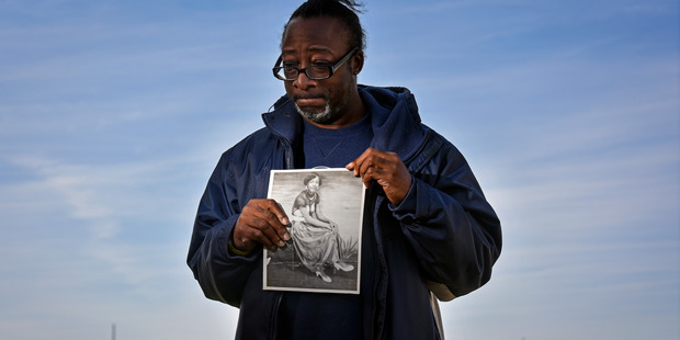 David Fuller III holds a portrait of his mother as a 16-year-old on February 12, 2017. Catherine Fuller was killed in 1984. Photo / Washington Post / Jahi Chikwendiu