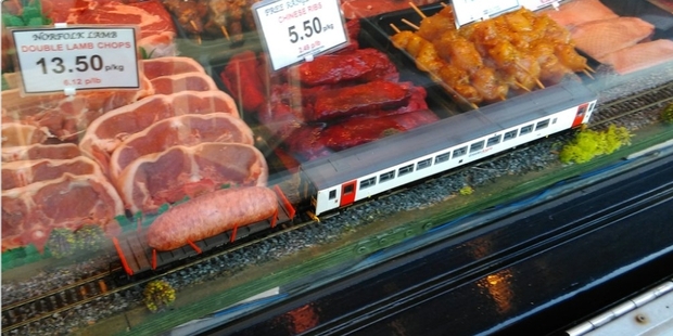 Innovative meat marketing: A butcher in Sheringham, Norfolk has added a moving toy train carrying a sausage to its meat display cabinet.
