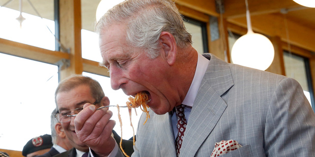 Prince Charles tastes a typical dish of pasta all'amatriciana in Amatrice, central Italy, this week. Photo / AP