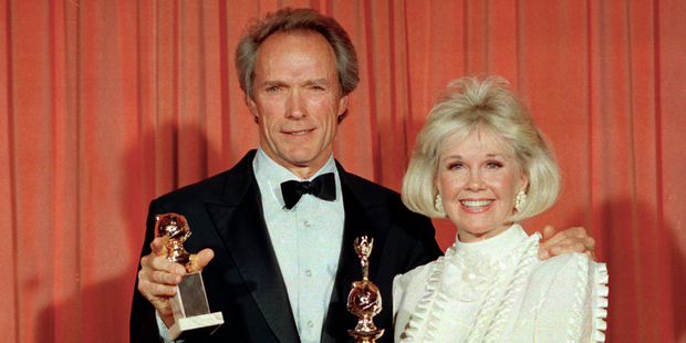 Actress Doris Day, pictured with Clint Eastwood in 1989, has discovered she is two years older than previously thought. Photo / AP