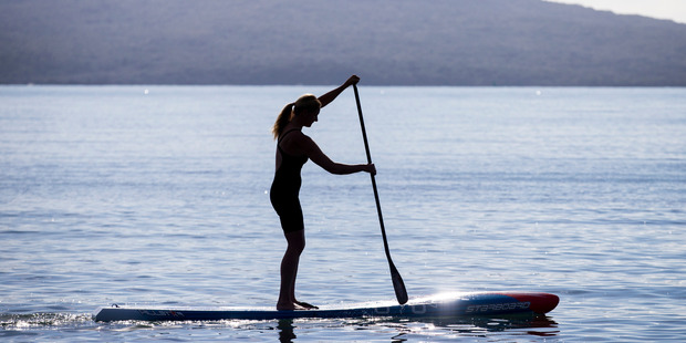 Penelope Armstrong, 38, won a world stand-up paddleboarding title in Fiji. Photo / Jason Oxenham.