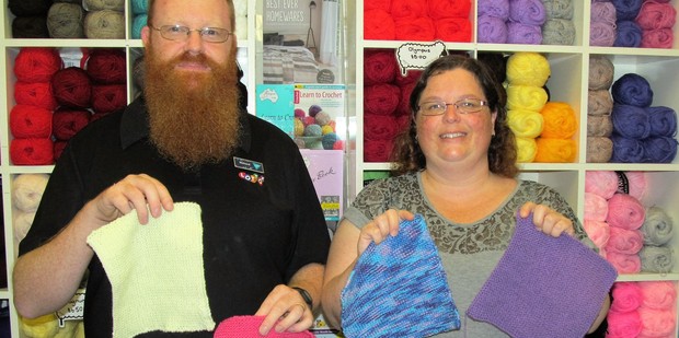 Richard and Paula McKeown with the beginnings of a new rhino baby blanket.