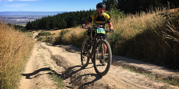 Michael Brown makes his way up the Body-bag track at Christchurch Adventure Park during the first stage of the 7 day Epic, Pioneer Mountain Bike ride along the Southern Alps. Photo / Greg Bowker
