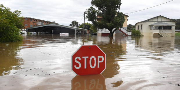 Loading Three people still missing in the wake of Cyclone Debbie. Photo / AAP