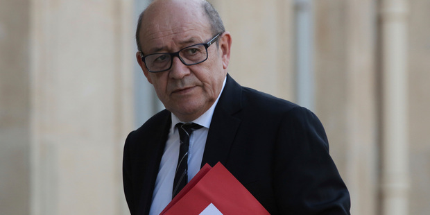 France's Defense Minister Jean-Yves Le Drian arrives for an emergency defense meeting, in Paris yesterday. Photo / AP
