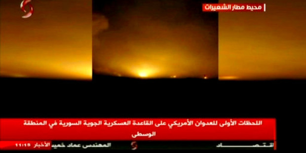 This frame grab from video provided by Ikhbaria TV, a Syrian pro-government TV channe, shows flames rising from US Tomahawk missiles. Photo / AP