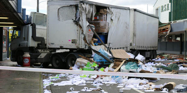 A truck left behind a trail of destruction in Bulls today.