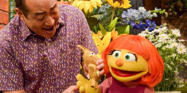Sesame Street locals including Alan Muraoka helped to quickly introduce Julia and explain her autism. Photo / AP