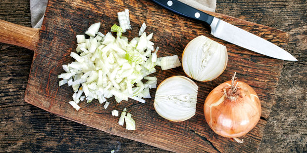 There is a way to chop an onion without your eyes watering. Photo / 123RF