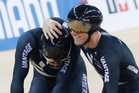 New Zealand's Eddie Dawkins, left, and Ethan Mitchell celebrate after winning the gold medal in the Men's Team Sprint. Photo / AP