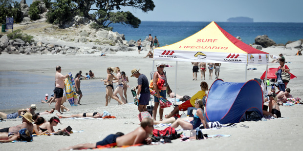 Many Aucklanders are flocking to Mount Maunganui. Bay of Plenty Times Photograph by Andrew Warner.