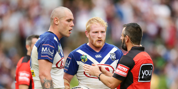 Referee Gavin Badger speaks to David Klemmer of the Bulldogs, left, after he slapped Daly Cherry-Evans of the Sea Eagles on the face. Photo /Getty