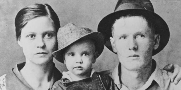 Rock and roll singer Elvis Presley poses for a family portrait with his parents Vernon Presley and Gladys Presley in 1937 in Tupelo, Mississippi. Photo / Getty