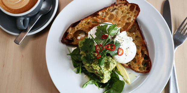Poached eggs with avocado. Photo / Getty Images