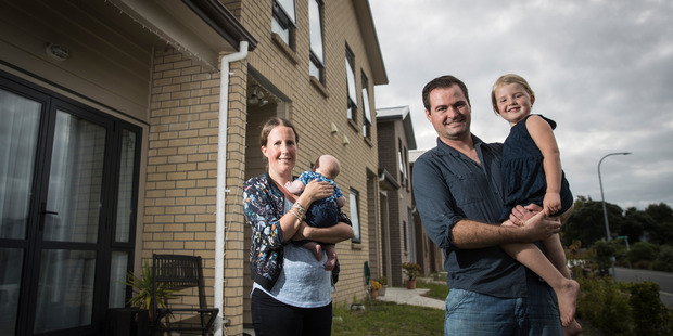 Lynette Douglas with her 8 week old son Josiah and husband Scott with their four year old daughter Katelyn outside their Weymouth Home, Auckland. Photo / Greg Bowker