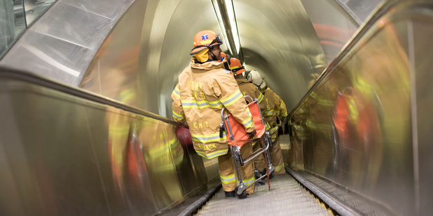 New York Fire Department make their way to a track at Penn Station after a stampede in the station. Photo / AP