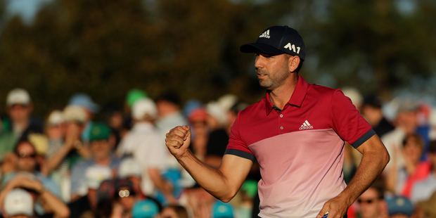 Sergio Garcia, of Spain, reacts after making his putt on the 18th hole during the third round of the Masters golf tournament Saturday. Photo / AP.