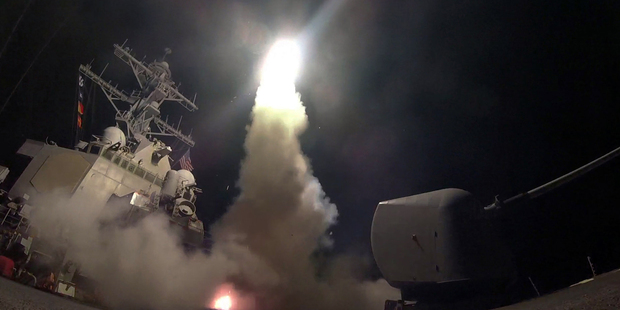The guided-missile destroyer USS Porter (DDG 78) launches a tomahawk land attack missile in the Mediterranean Sea as the United States blasted a Syrian air base. Photo / AP