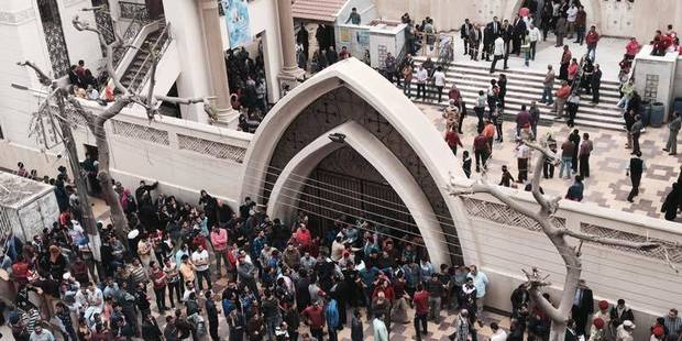 Relatives and onlookers gather outside a church after a bomb attack in the Nile Delta town of Tanta, Egypt. Photo / AP