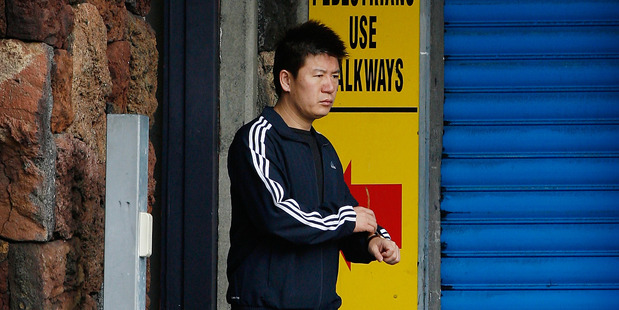 Yong Ming Yan leaves the Auckland Central Police Station after a bail check. Photo / Greg Bowker.