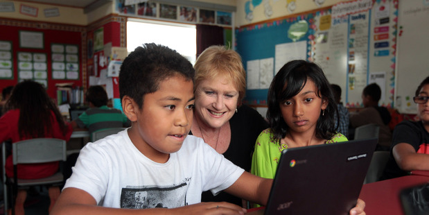 NZEI president Lynda Stuart with students at her school, May Road School, in 2014. Herald on Sunday photograph by Doug Sherring