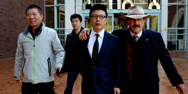 William Yan outside the High Court during his 2012 with Dover Samuels, former Labour MP. Photo / Brett Phibbs.
