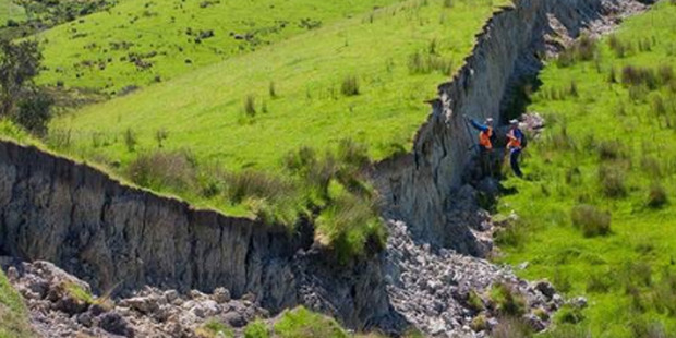 Scientists inspect ground raised into a wall near Waiau by the November 7.8 M earthquake. Photo / Kate Pedley, University of Canterbury