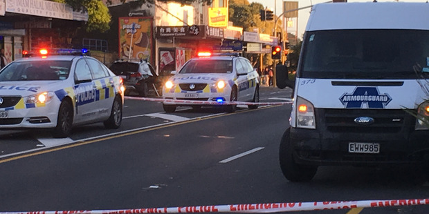 Loading Police at the scene of a robbery of an Armourguard van at ASB Bank in Dominion Road Auckland