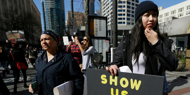 People protesting in Seattle for US President Donald Trump to release his tax returns. Photo / AP