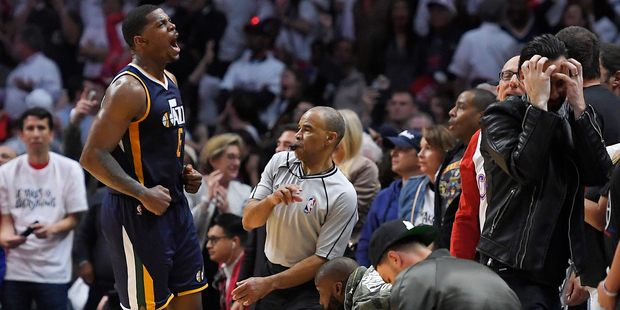 Utah Jazz forward Joe Johnson, left, celebrates after hitting the game-winning basket. Photo / AP
