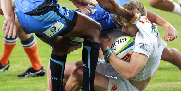 Damian McKenzie is tackles by Marcel Brache of the Force during the Chiefs' win. Photo / Getty